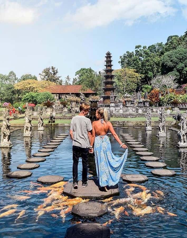 Bali: Trip to Tirta Gangga Palace and Tukad Cepung Waterfall - Tukad Cepung Waterfall: a cave, sunlight beams, and a swim option