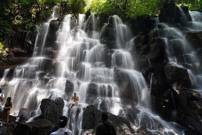 Discover the best waterfalls in Ubud and rice terraces tour - Kanto Lampo Waterfall: dramatic rock lines and a river under the fall