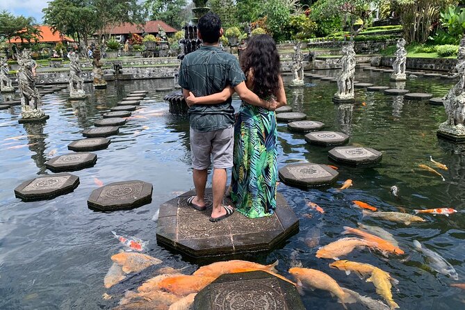East Bali Lempuyang Temple Tirta Gangga and Waterfall Tour - Tirta Gangga’s water palace gardens: peaceful walking with real character
