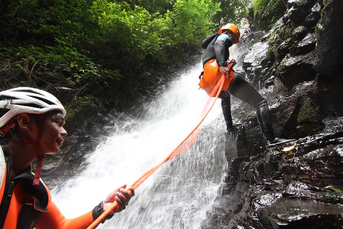 Intermediate canyoning trip in Bali " Samba canyon " - Entering Samba Canyon: slides, jumps, and abseils