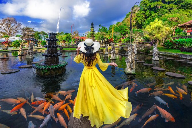 Lempuyang Temple Tirta Gangga Tukad Cepung waterfall and Swing - Tirta Gangga water palace (fish pool): a colorful break from temple climbing