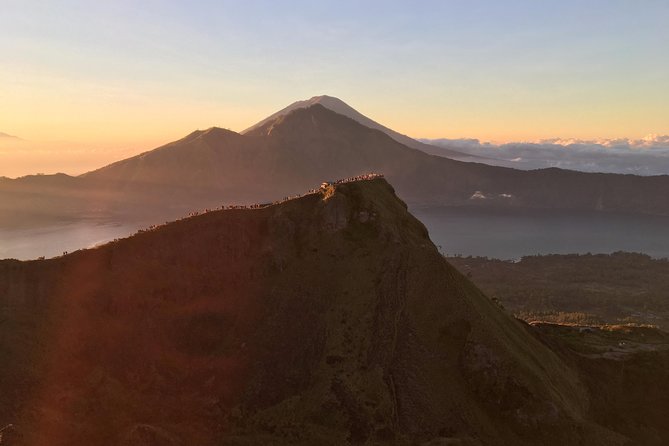 Mount Batur Sunrise Trekking with Breakfast - Torch-Lit Ascent to the Summit: poles, water, and a demanding first climb