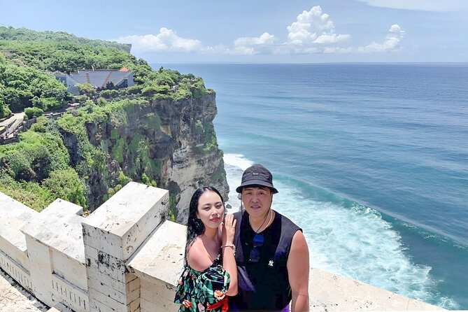 Private Bali Romantic Couple Tour with Parasailing Adventure - Uluwatu Temple cliff views: a scenic stop that adds romance to the drive