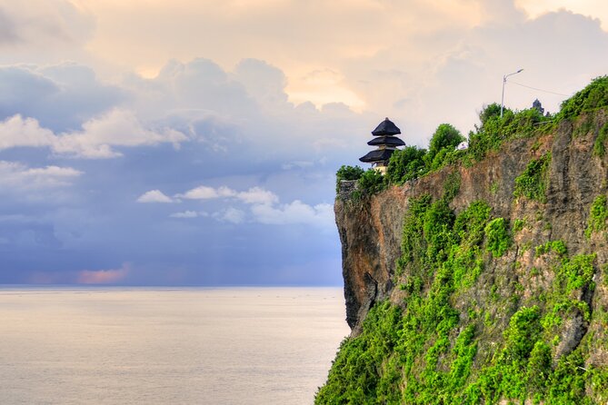 Private Tour: Uluwatu Temple & Southern Bali Highlights - Pandawa Beach: statues, blue water views, and actual beach time