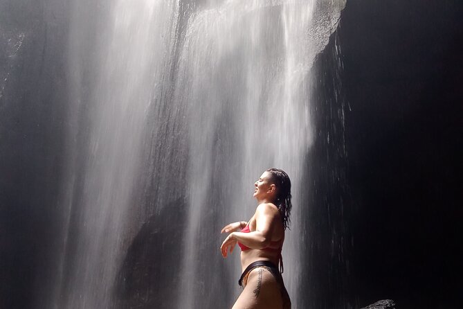 Ubud Hidden Gems Waterfalls and Private tour - Stop 1: Goa Raja Waterfall in a Cave Setting